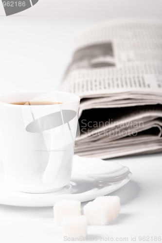 Image of coffee, sugar and newspapers