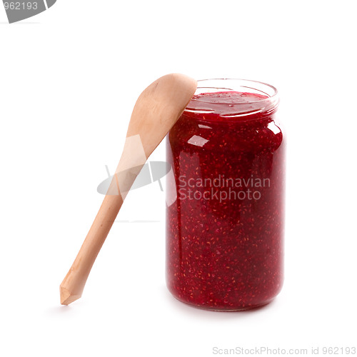 Image of  homemade raspberry jam and wooden spoon