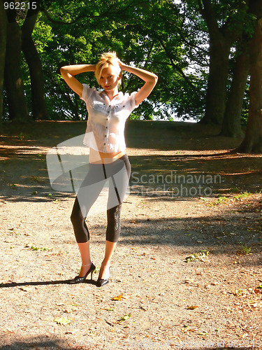 Image of Lady standing in the park.