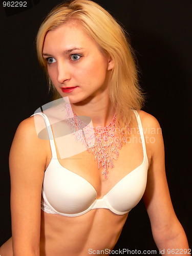 Image of Lady in white bra.