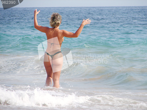 Image of Girl in bikini and blue sea