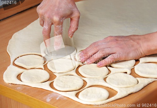 Image of Hands od raw dough preparing pastry