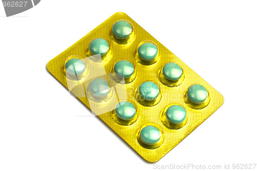 Image of Package of green pills isolated on white 