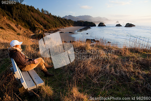 Image of woman enjoying view at Oregon Coast