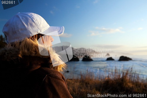 Image of woman at coast overlooking ocean