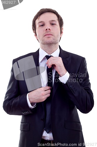 Image of  man adjusting his tie