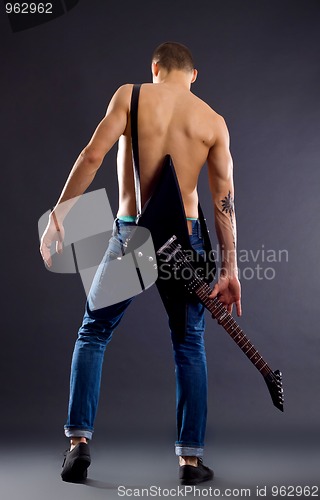 Image of back of a guitarist