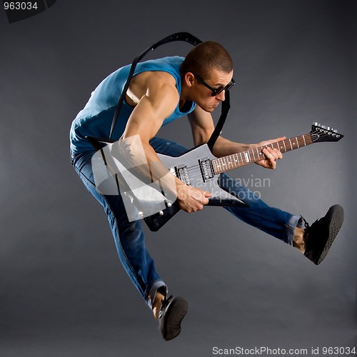 Image of guitar player jumps