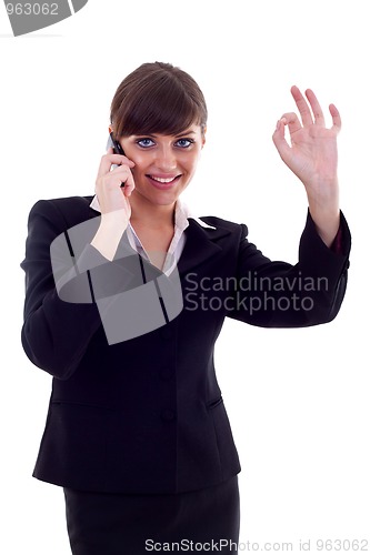 Image of woman with phone and ok gesture