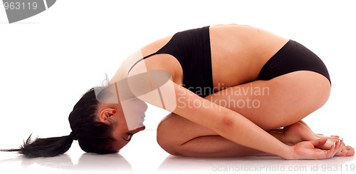 Image of Young woman exercising yoga 