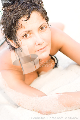 Image of woman lying on a sand