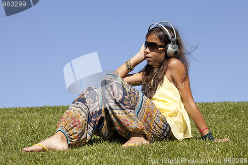 Image of young child listening music