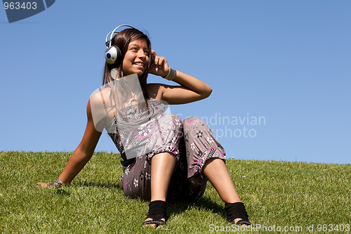 Image of young teenagerlistening music