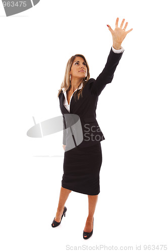 Image of Businesswoman reaching something