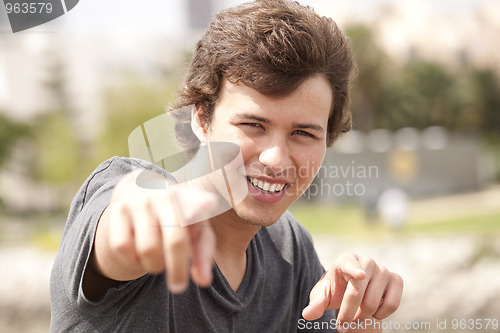 Image of Teenager pointing to you