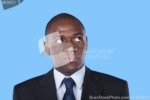 Image of African businessman looking up