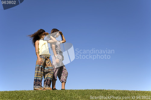 Image of Happy sisters at the field
