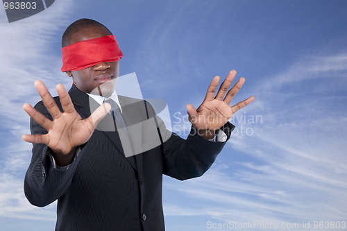 Image of blindfold african businessman