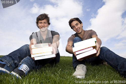 Image of Students showing his school books