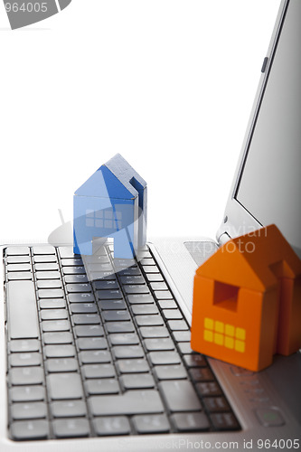 Image of House toy over a laptop