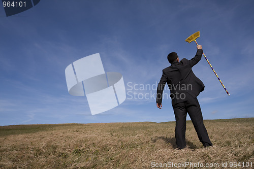 Image of businessman cleaning the environment