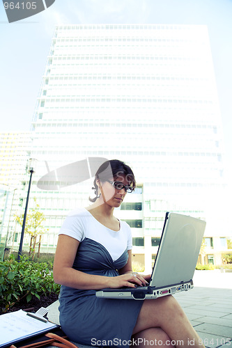 Image of businesswoman working outdoor