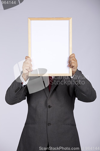 Image of businessman holding a whiteboard