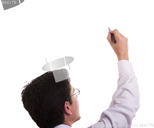 Image of businessman writing at a whiteboard