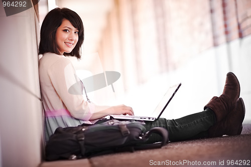 Image of Mixed race college student with laptop