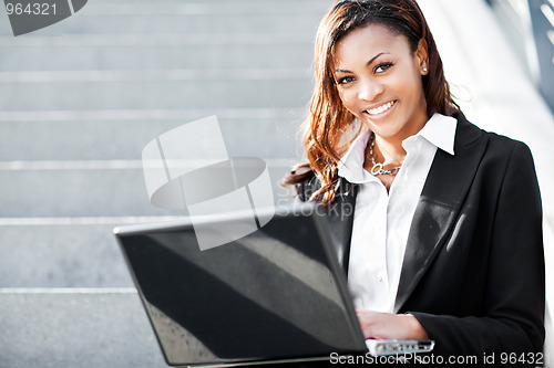 Image of Black businesswoman with laptop