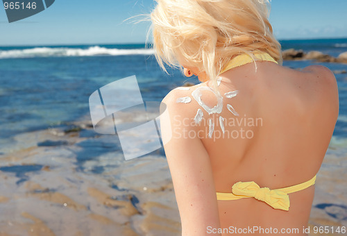 Image of young woman at the beach