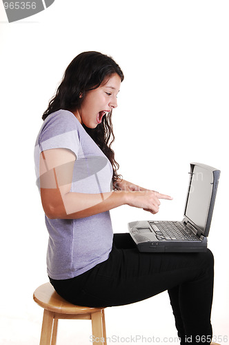 Image of Happy girl with laptop.