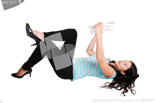 Image of Girl lying on floor.