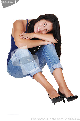 Image of Girl sitting on the floor.