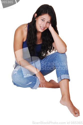 Image of Girl sitting on the floor.