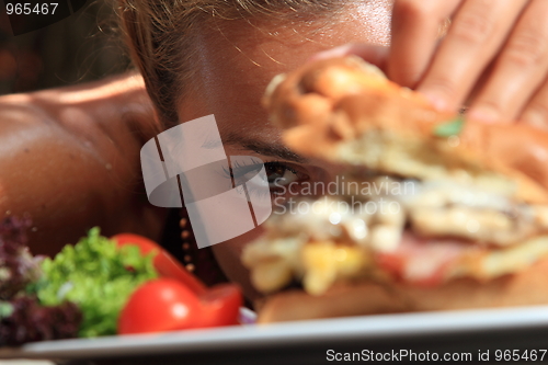 Image of Eating a yummy cheeseburger 