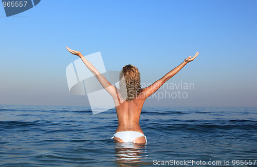 Image of topless in water 