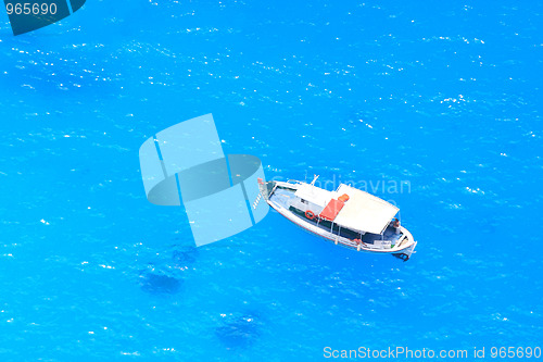 Image of boat in deep blue water