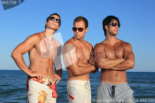 Image of Men Relaxing On the Beach