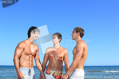 Image of Men Relaxing On the Beach