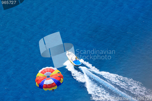 Image of Sport activity - para sailing over the sea 