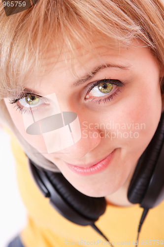 Image of Woman with headphones listening to music