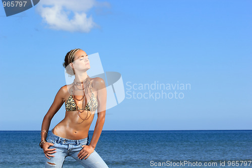 Image of Beautiful woman by the sea