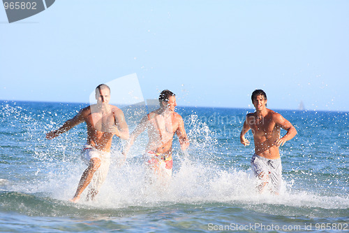 Image of Men Relaxing On the Beach