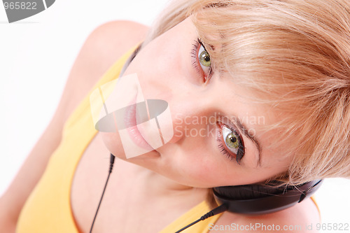 Image of Woman with headphones listening to music