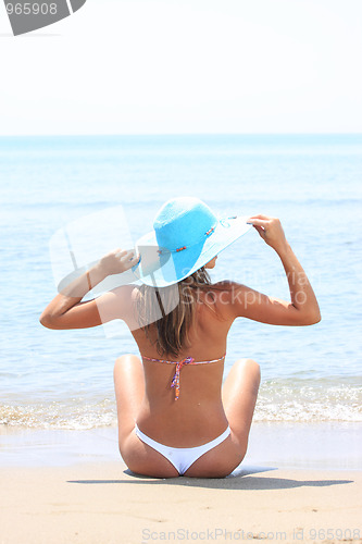 Image of Woman playing in the ocean