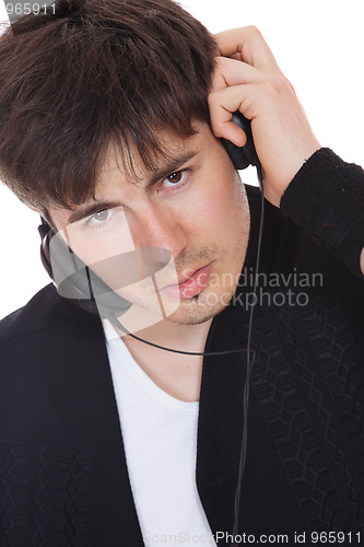 Image of Young man listening music
