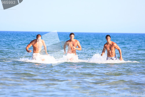 Image of Men Relaxing On the Beach