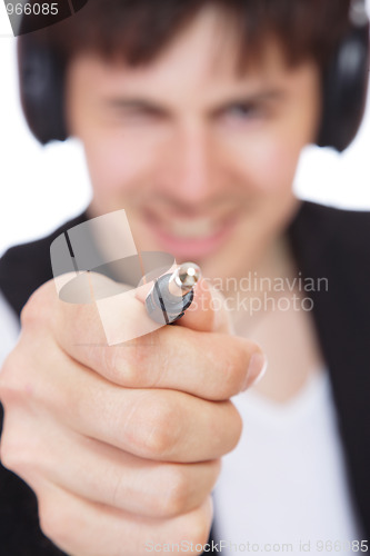 Image of Young man listening music