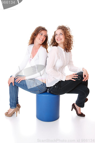 Image of Two women on a stool